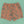 Killer Acid Cretaceous Cosmonauts swim trunks, salmon-orange with teal line-art dinosaurs, aliens and UFOs