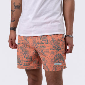 Killer Acid Cretaceous Cosmonauts swim trunks, salmon-orange with teal line-art dinosaurs, aliens and UFOs