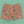 Killer Acid Cretaceous Cosmonauts swim trunks, salmon-orange with teal line-art dinosaurs, aliens and UFOs