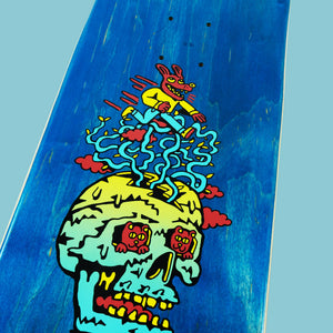 Blue maple skateboard deck with "Pay No Mind" Killer Acid design: a vibrant skull and running red creature.