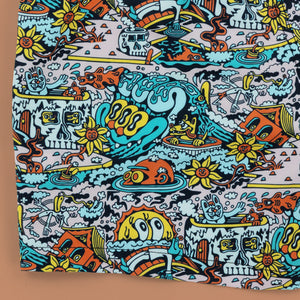 Killer Acid Summer Slime swim trunks with a busy cartoon print of melting slime, smiley suns and skulls in teal, orange and yellow