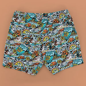 Killer Acid Summer Slime swim trunks with a busy cartoon print of melting slime, smiley suns and skulls in teal, orange and yellow