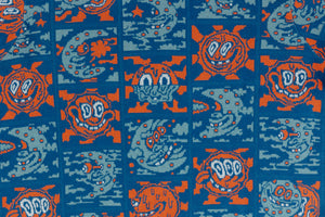 Blue jacquard knit cotton sweater with orange grinning suns and mischievous moons.